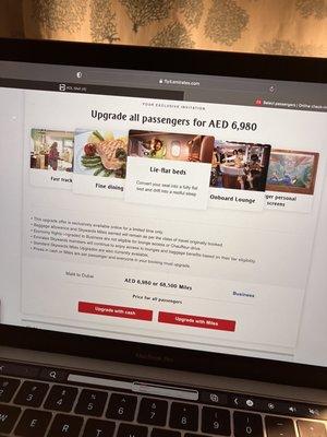 BUYERS BEWARE-Bait and switch-False advertising  Received email from Emirates about upgrading our upcoming trip .