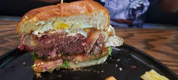 ASK FOR THE DASH BURGER- patty mid rare w corned beef Swiss cheese jalapenos horseradish mayo over easy egg lettuce tomatoes and bacon.