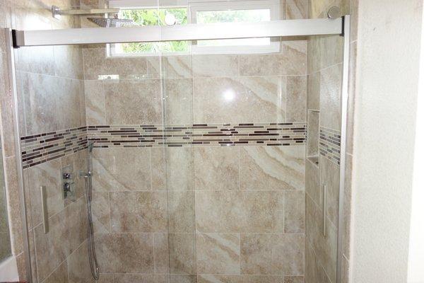 MSI Aliso Bone 12x24 tile, MSI Amalfi Cafe mosaic, Kohler Levity 59x74 sliding door