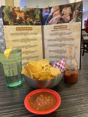 Chips and salsa with cilantro.