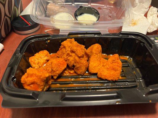 Boneless chicken wings? No carrots or celery.  These are chicken bites similar to so many other chains.