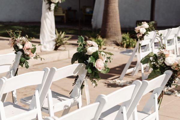 chairs/aisle with rose petals