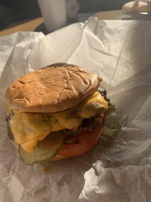 Double cheese burger with everything on it