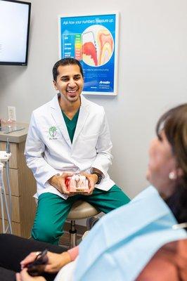 Dr. Vasa explaining the Dental Implant process.