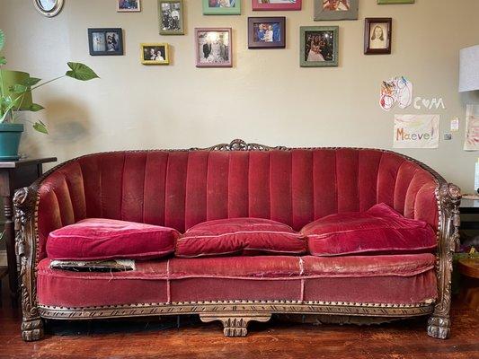 A 70-year-old heirloom sofa before restoration and reupholstery