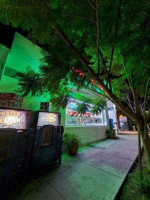 Front of the store at night.