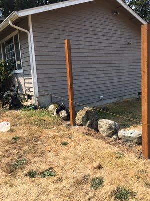 They were able to work with part of our yard that is retained with boulders.