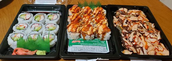 My dinner (left to right: California Rolls, spicy tuna & shrimp volcanoes rolls & squid salad)