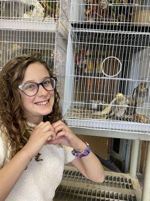 Daughter with soon-to-be new cockatiel pet.