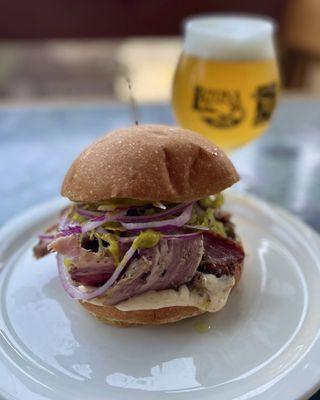 House-made porchetta on brioche with herbed mustard, garlic mayo, red onion and pepperoncini