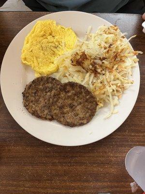 Two 2 Eggs (Large) (Any Style), sausage patties and hash browns.