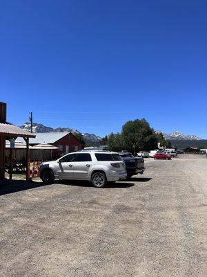 Gravel road and mountains view outside of the restaurant.