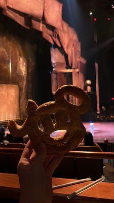 Mickey Pretzel but just a tip they don't let you keep anything on the wall in front of our seats as performers walk by