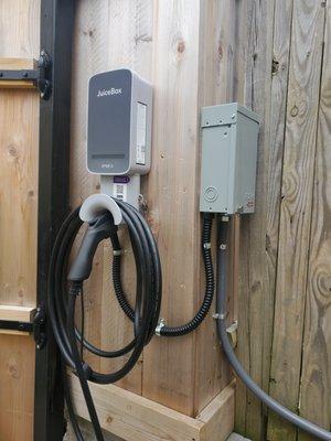 This charger is mounted inside the backyard fence so the customer can charge right off the alley behind their townhouse.