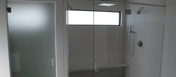 Frameless shower enclosures