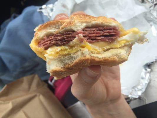 Pastrami egg and cheese on a roll