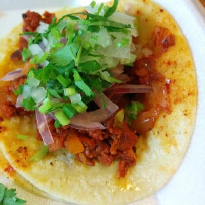 Pork taco with toppings.