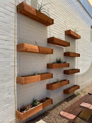 Outdoor seating area with cute planter boxes