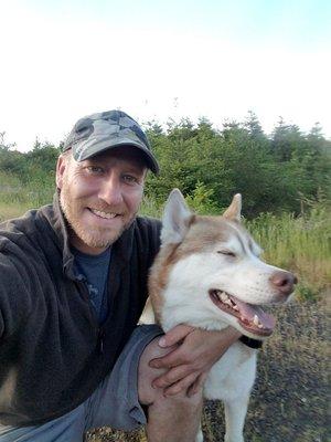 Tim and Tugo on a walk along NW skyline after a day of running estimates.  My husky more likes to take me for walks...lol