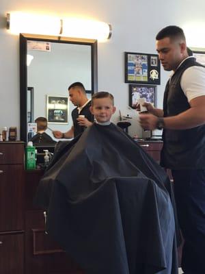 Larit getting his hair cut with Mr. Nester!