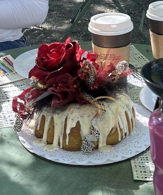 A delicious Lime bundt cake with pretty roses & ribbon decoration added.