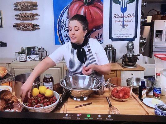 She's about to finish hulling enough strawberries to make the delicious crepe filling. 12 cups of strawberries in all.