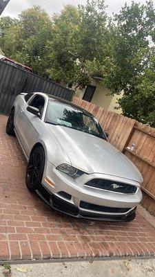 Glossy black hood wraps on Ford Mustang