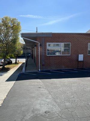 Building from the parking lot. Main entrance is down the path on the left.