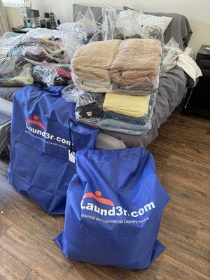 Laundry gets returned in these hefty blue bags and then inside items are packaged together!