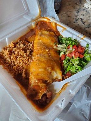 Picking up a smothered bean burrito with red chili for dinner.