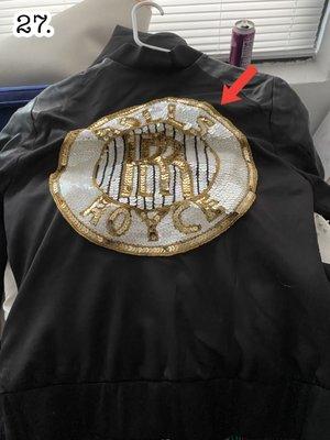 A custom-made jacket ruined because USA Logistics shoved it into the bottom of a box.