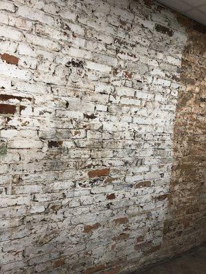 Old wall meets new taproom, near the toilets.