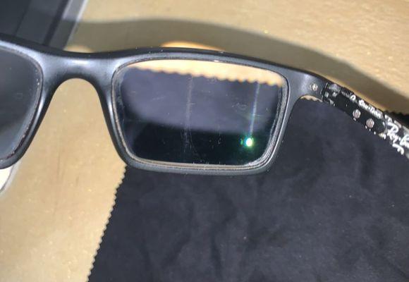 Defect in lenses running vertically through BOTH lenses in the SAME spot! Warrantied? No. I was told I did it!