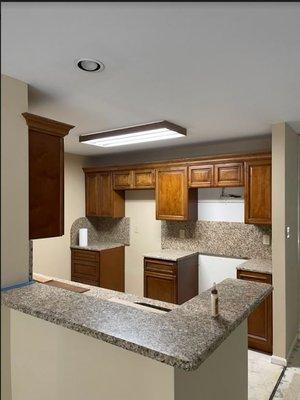 Kitchen installed in Linwood with L&Z's Mocha cabinets and New Venitian Gold granite countertops with full granite backsplash.