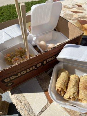 Eating the ha-kaw, Siu-mai and bean curd rolls outside.