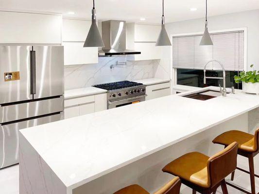 White cabinets and counters allow for certain accent pieces to really pop out like mustard chairs or plants!