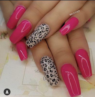 Acrylic set of nails with beautiful hot pink gel polish and a sexy accent nail of leopard print!