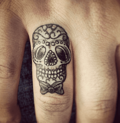 Sugar Skull on my ring finger tattooed by Erik