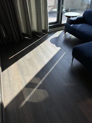 Installed luxury vinyl planks with a natural beveled edge