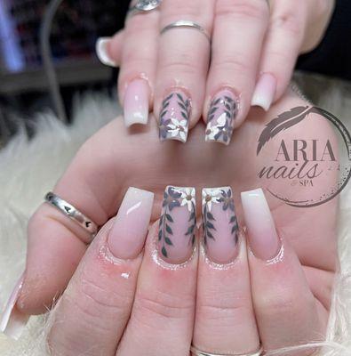 Floral finesse at your fingertips!  Visit Aria Nails & Spa for your nail art bloom. #AriaFloralNails