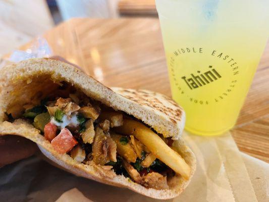 The Esquire Pita Sandwich with chicken Sriracha Tahini, French fries and mango lemonade.