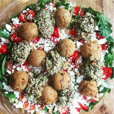 Santorini- Grape tomato, chick pea, quinoa mix, feta, baked falafel, toasted almond, lemon vinaigrette on your choice of organic greens.