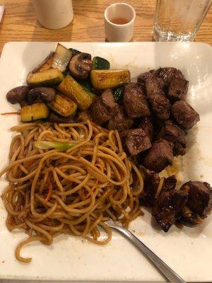 Ribeye with fried noodles.