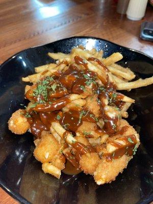 Poutine w cheese curds and chicken fingers.   Yummy fries.  Gravy was unimpressive.