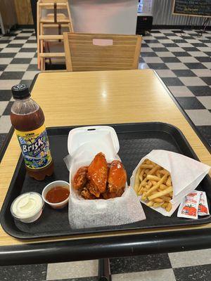 Six piece wing basket with french fries, ranch, and a brisk tea along with buffalo sauce on the side.