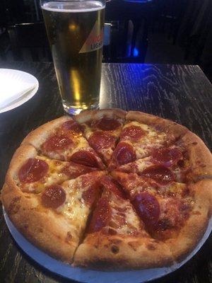 Small pepperoni pie and cold draft brew