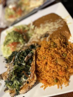 Grilled Chicken smothered with Spinach/ Mushroom, Beans, rice and Avacado salad.