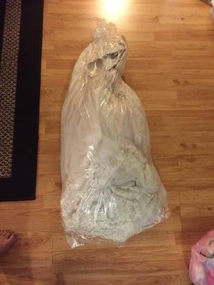 Attached is how I RECEIVED my tool, lace and beaded detailed wedding dress. THROWN IN A BAG WITH OUT A HANGER!!!!