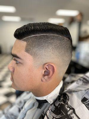 Haircut performed by Eminence Barber Academy student.