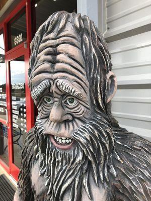 10/14/19. Monday morning. Exterior. Bigfoot!! He's comfortably seated on a bench right outside the storefront here!!